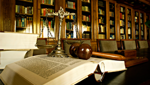 Justice scale and a gavel kept on a book