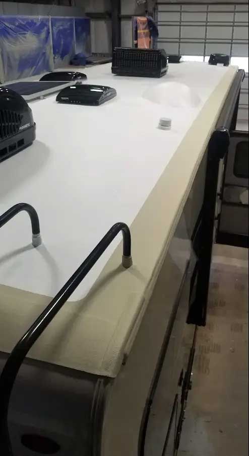 A white counter top with a fan on top of it.