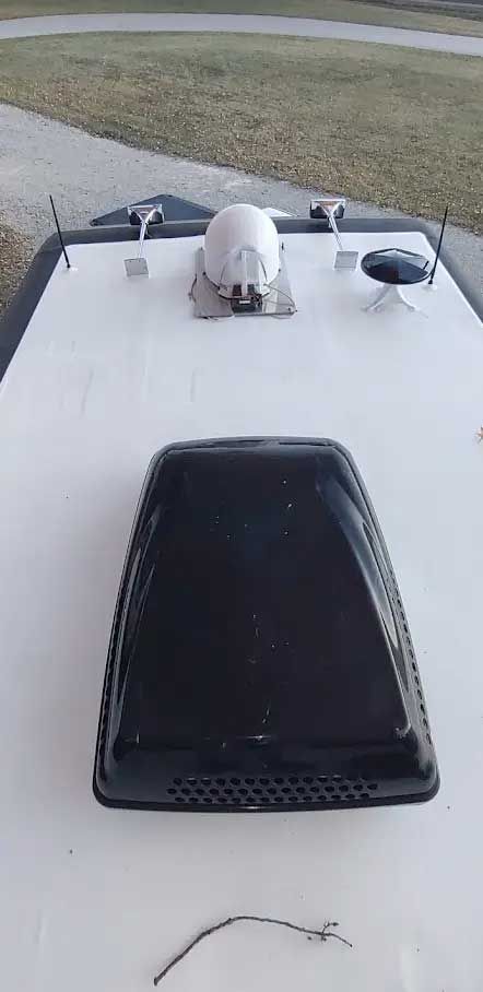 A close up of a roof vent on a boat.