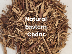 Pile of brown cedar mulch labeled “Natural Eastern Cedar”