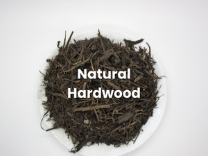Pile of dark mulch labeled “Natural Hardwood” on a white background