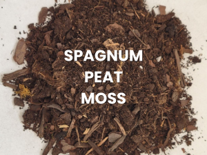 Pile of brown sphagnum peat moss with white text label on a light background