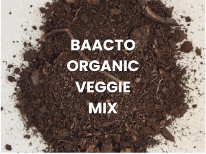 Baacto Organic Veggie Mix in white text on a pile of brown soil