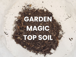 Garden Magic Top Soil on a small pile of dark soil on a white background