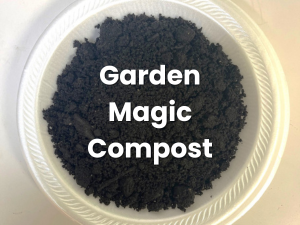 Garden Magic Compost text on a bowl of dark compost granules