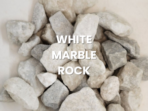 Pile of white marble rocks with text overlay reading “WHITE MARBLE ROCK”