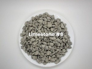 White bowl of gray crushed stone labeled “Limestone #8”
