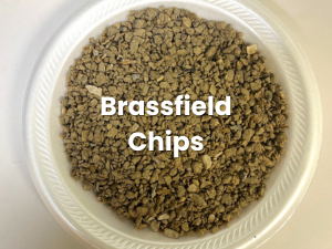 White bowl of brown gravel-like chips labeled “Brassfield Chips”