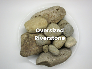 Assorted smooth river stones in a white bowl, labeled “Oversized Riverstone”