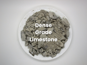 Plate of gray crushed rock labeled “Dense Grade Limestone”