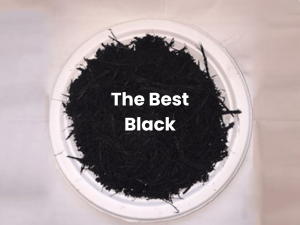 Black powder in a clear dish labeled “The Best Black”