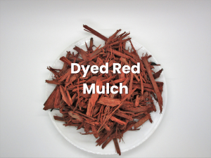 White plate of red mulch with overlaid text “Dyed Red Mulch”