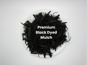 Premium black dyed mulch in a white bowl
