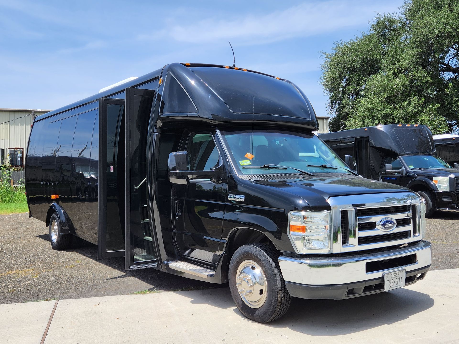 Black passenger shuttle bus with open door