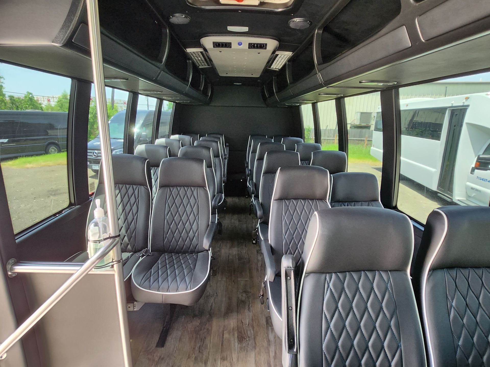 Interior view of a black and gray passenger bus
