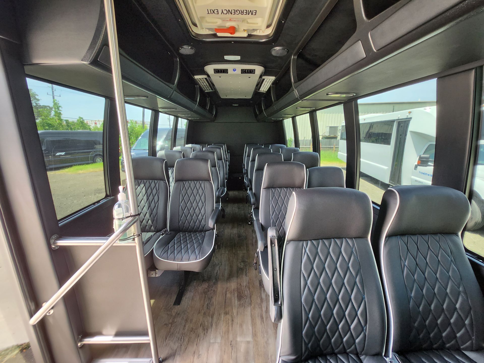 Interior of a bus with black leather seats in rows