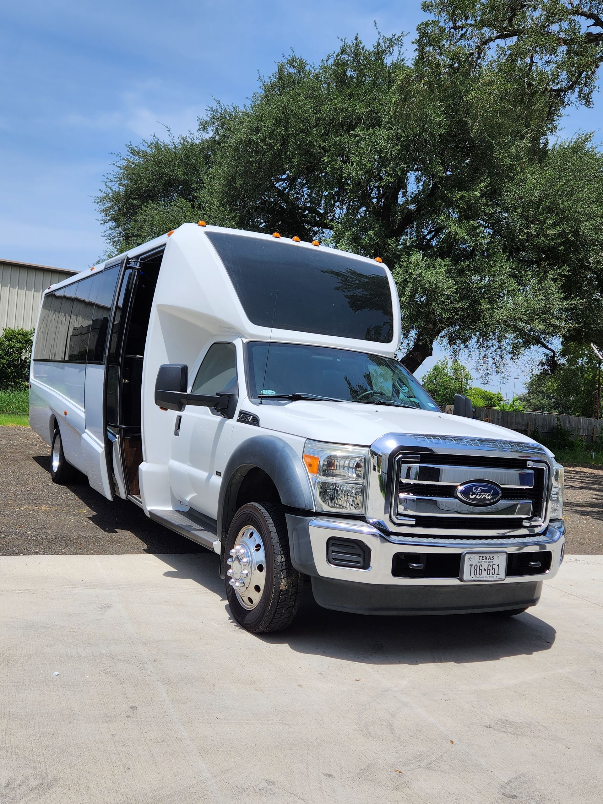 White passenger bus with black tinted windows