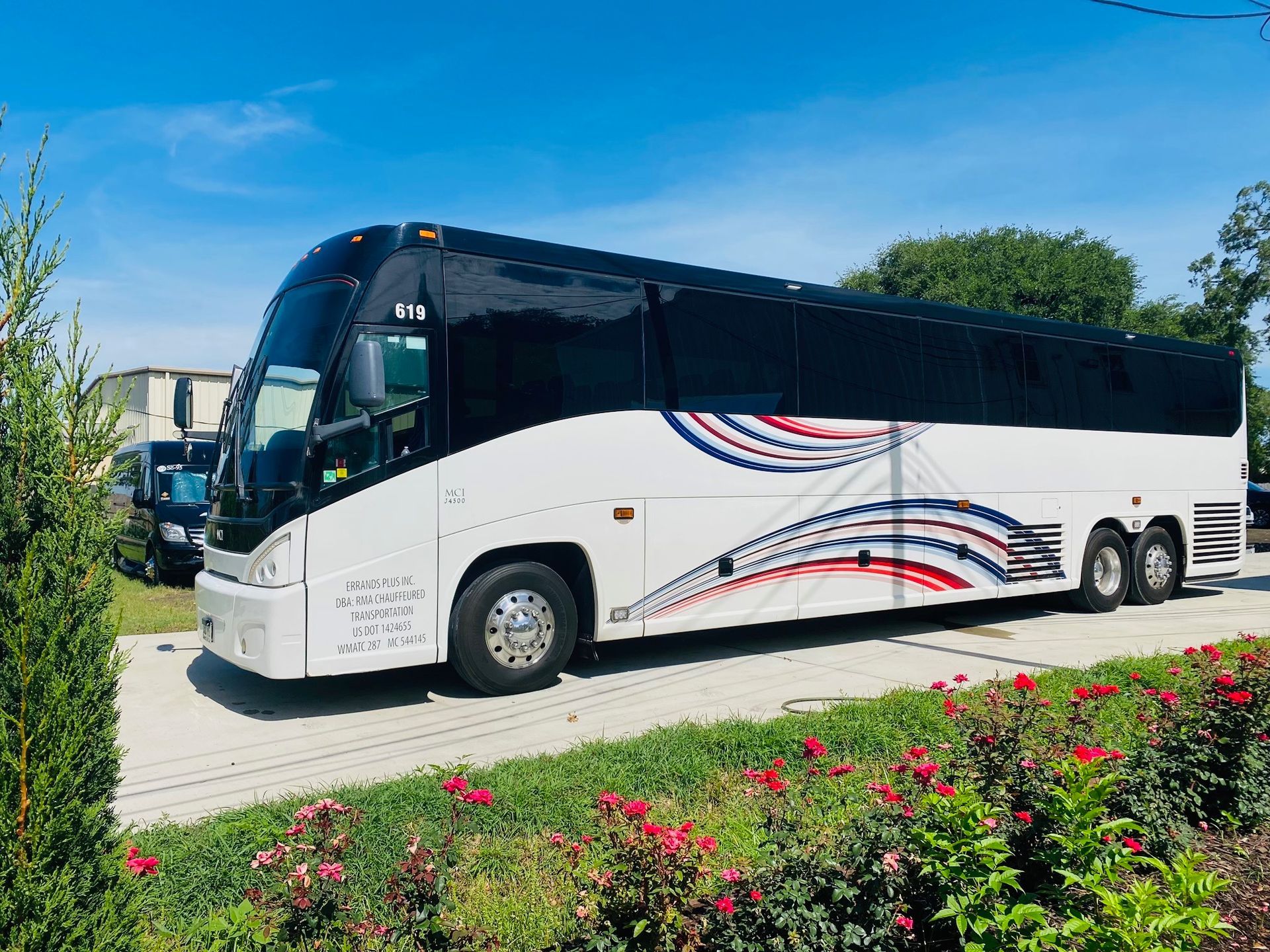 A white bus with black windows