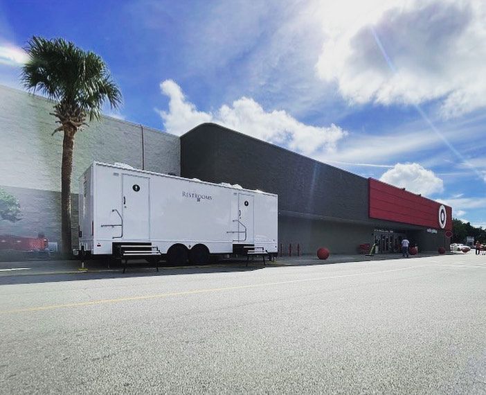A white trailer is parked in front of a target store