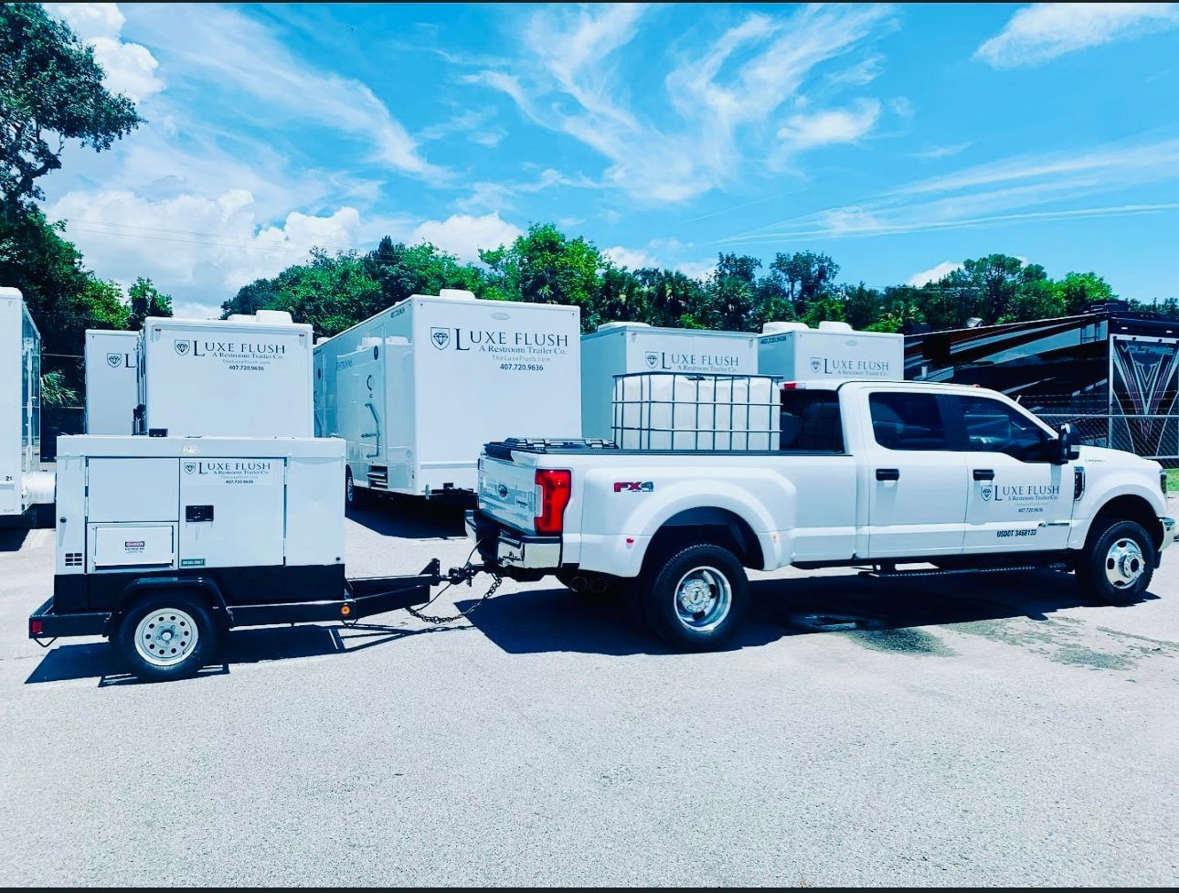 A white truck with a trailer attached to it
