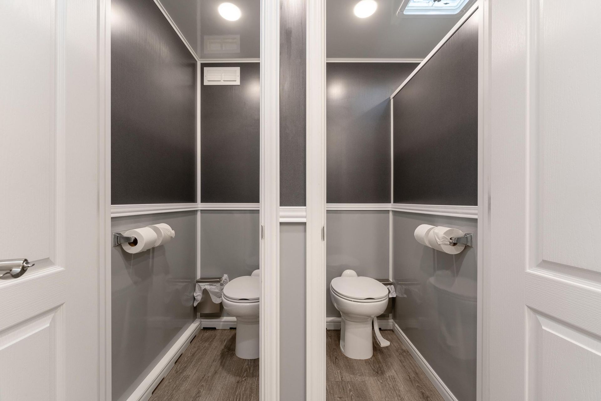 Two toilets are sitting next to each other in a bathroom