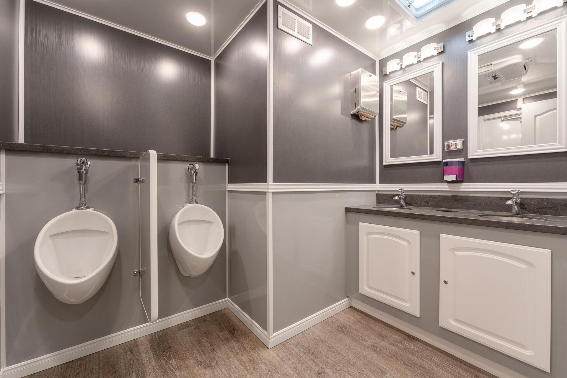 A bathroom with two urinals and two sinks