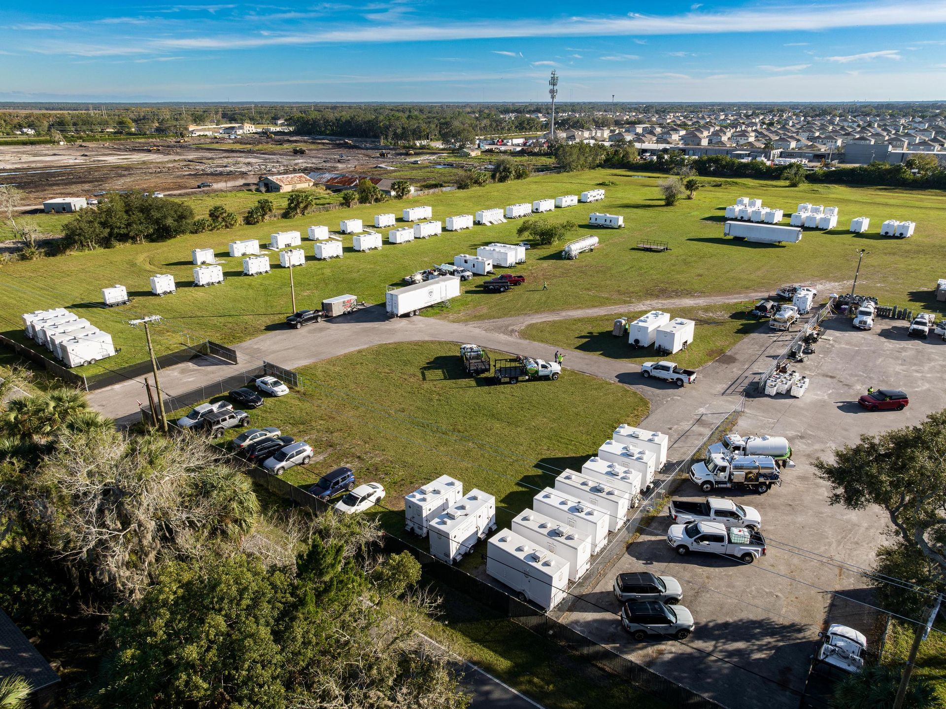 An aerial view of a park with a lot of trailers parked in it