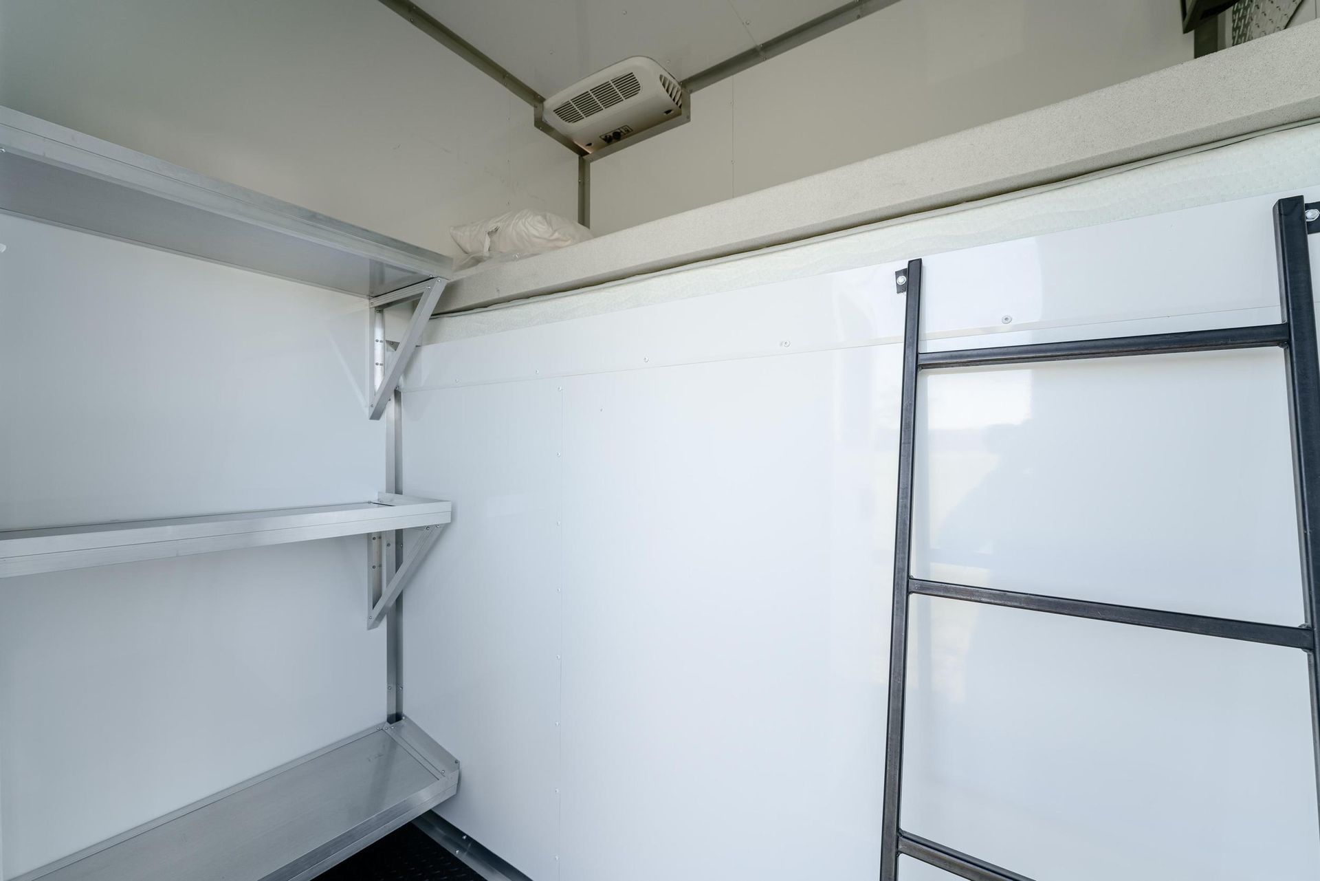 There is a ladder in the corner of the room