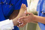 Nurse holding foot