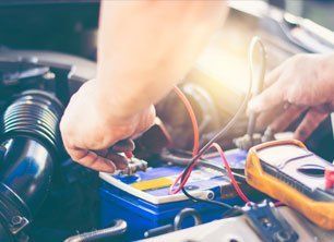 checking the voltage level in a car battery