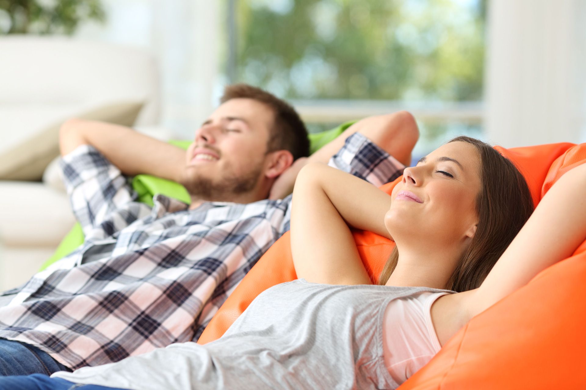Couple relaxing in an air conditioned room
