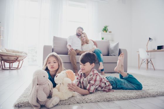 Family relaxing in a warm living room