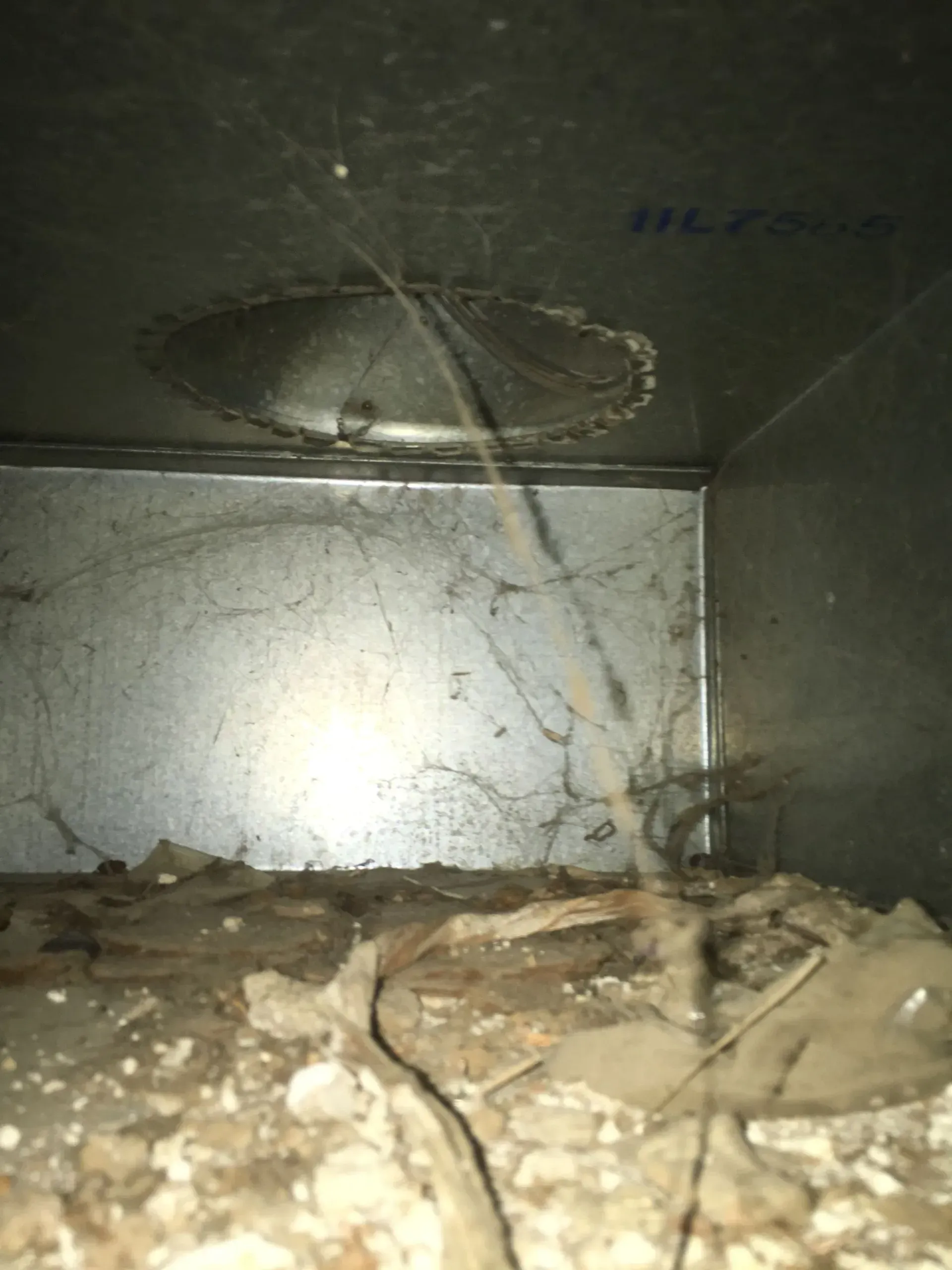 A close up of a metal box with a hole in it.