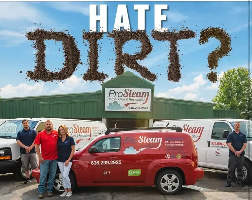 A group of people standing in front of a pro steam van