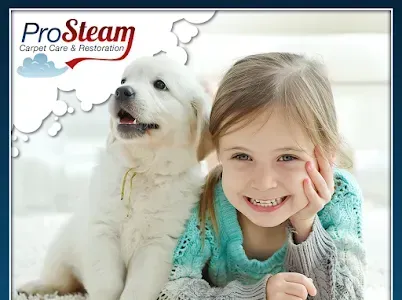 A little girl is laying on the floor next to a white puppy.