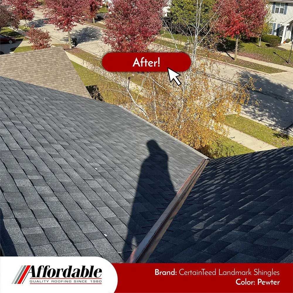 Newly shingled roof, dark gray color, with an