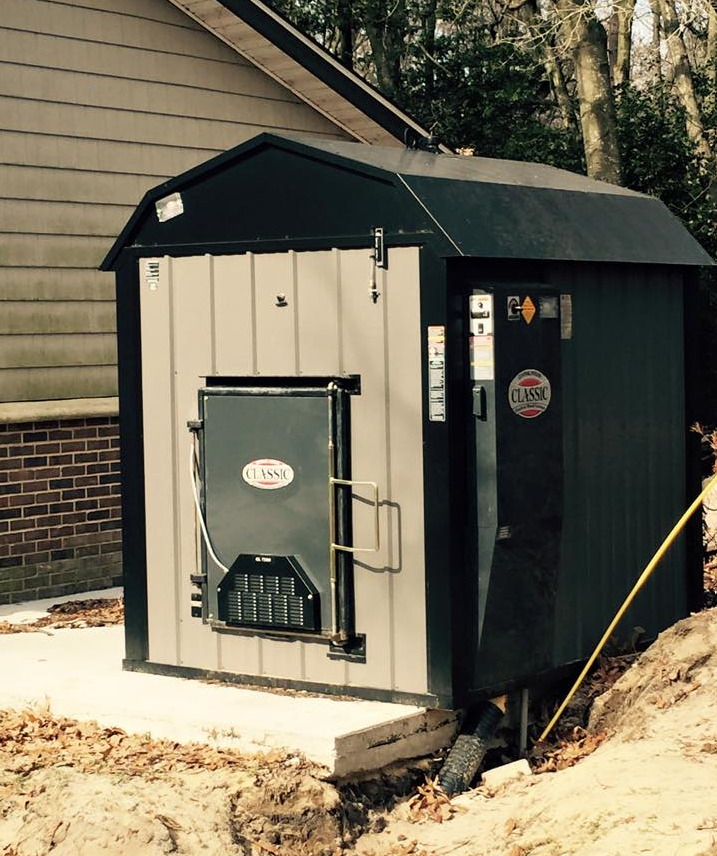 A small shed with a door that says ' a ' on it