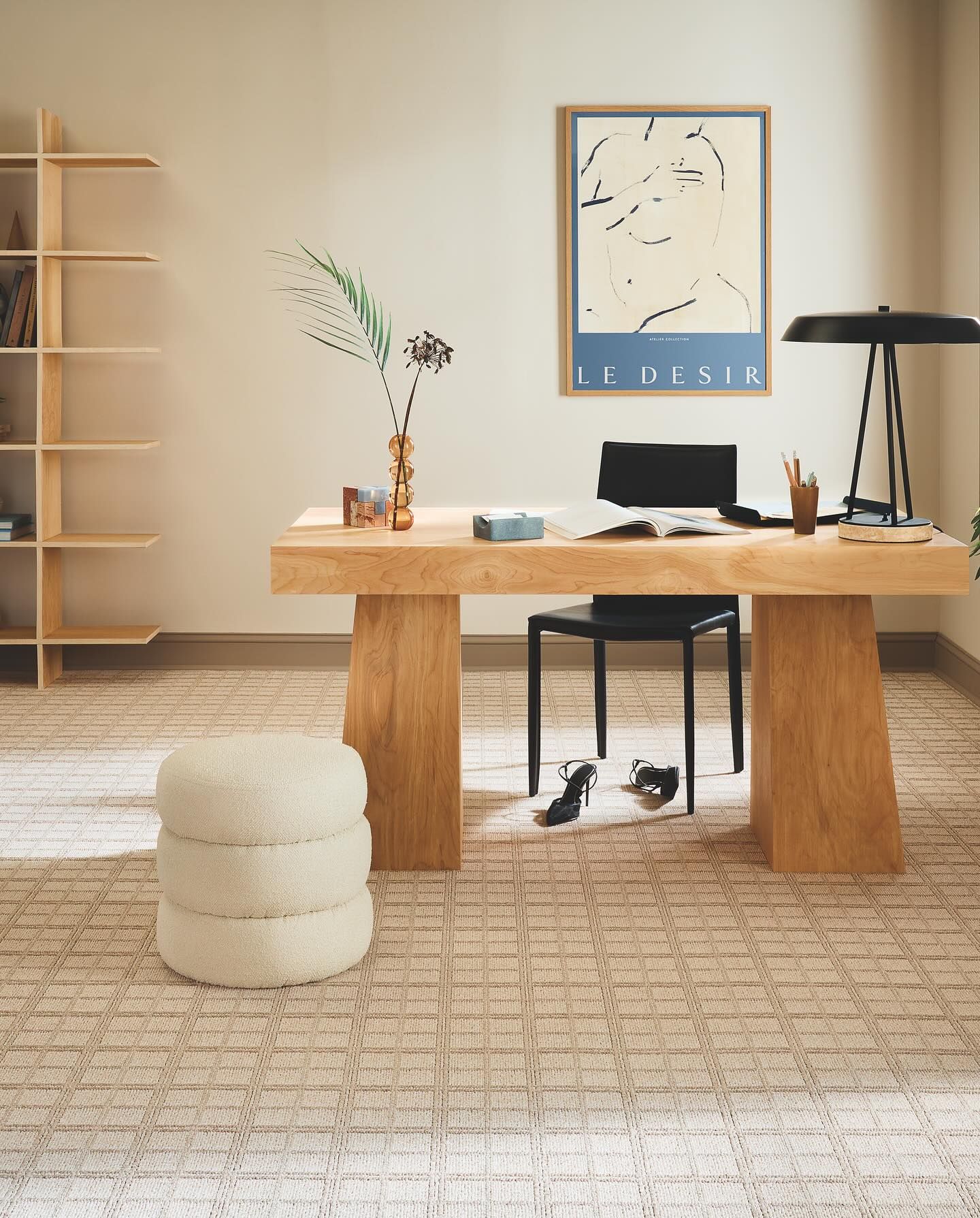A wooden desk with a chair and a computer on it
