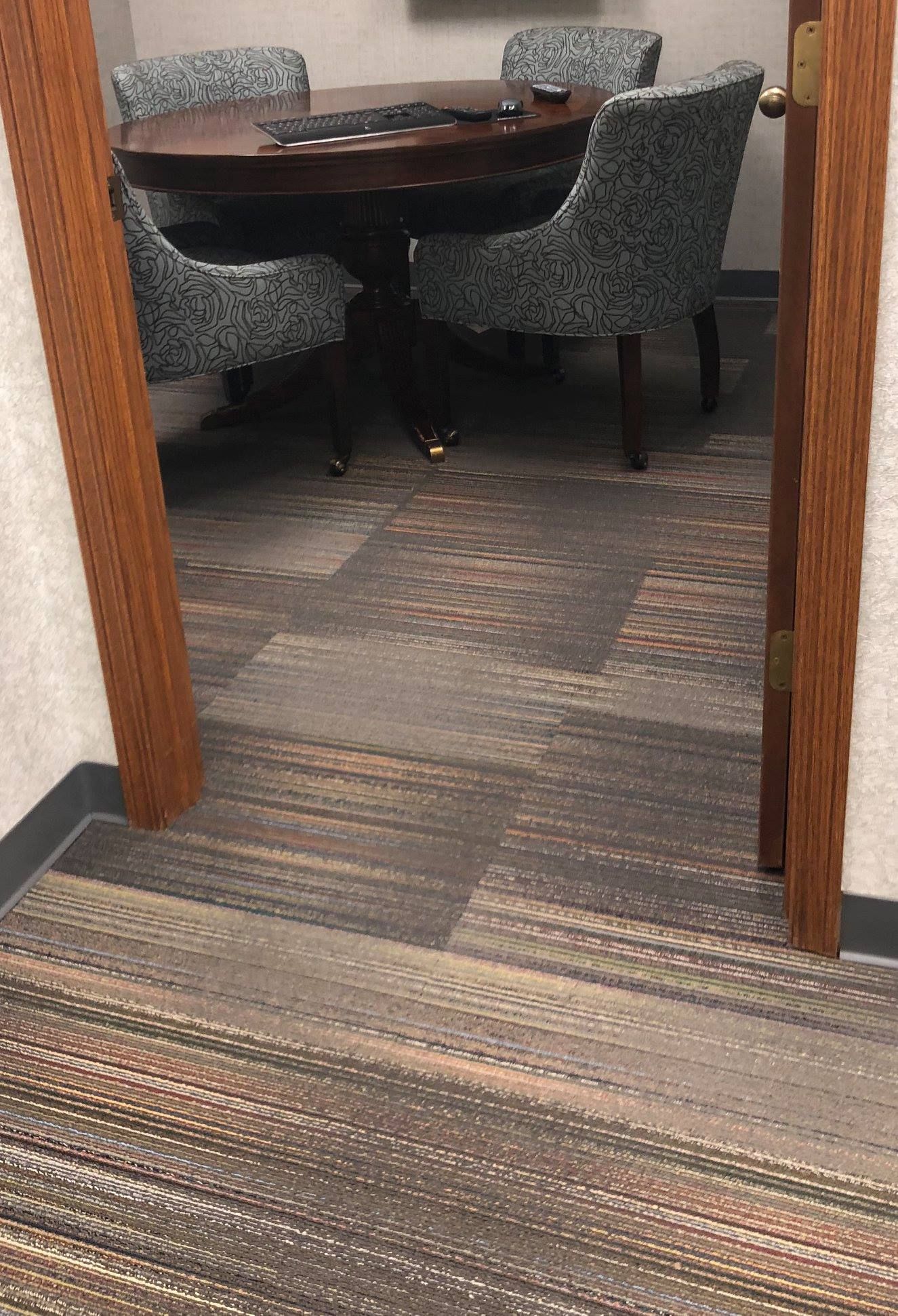 A room with a table and chairs in it.