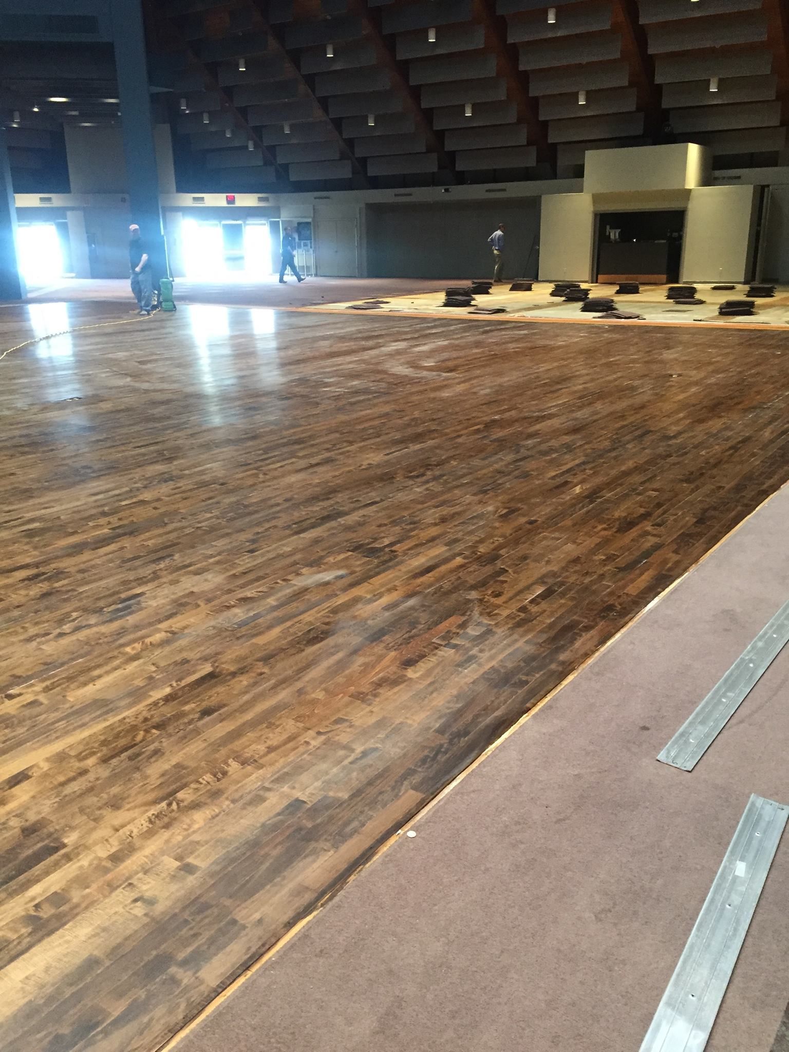 A large empty room with a wooden floor