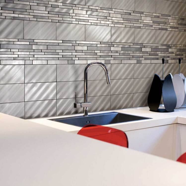 A kitchen counter with a sink and a faucet