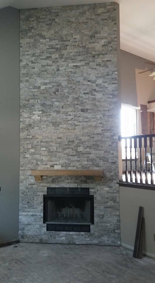 There is a fireplace in the middle of the room.