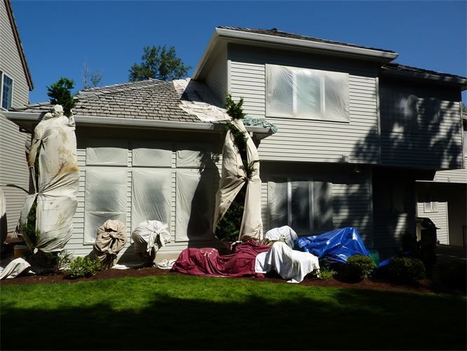 A house with a lot of tarps on it