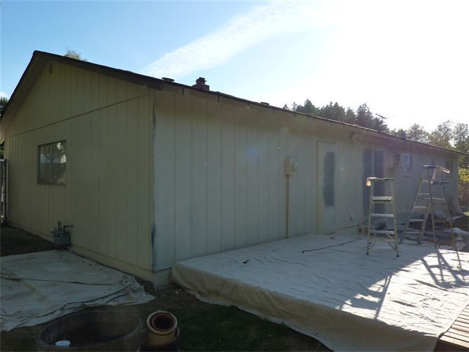 A house with a ladder on the side of it