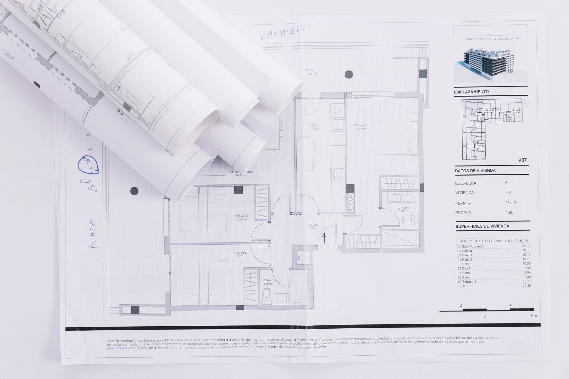 Printing press in operation; colorful paper sheets moving along rollers.