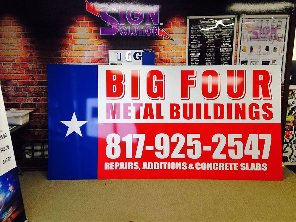 A sign for big four metal buildings repairs additions and concrete slabs