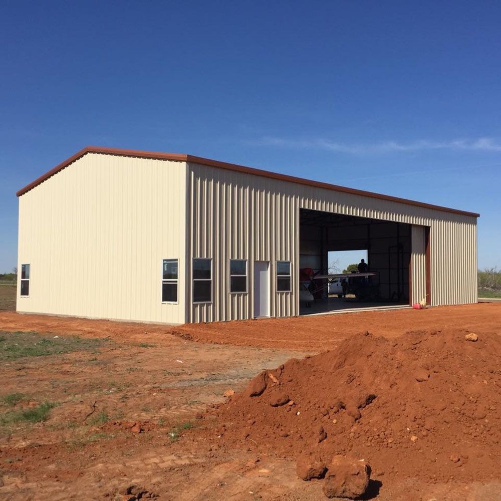 A large metal building with a large sliding door