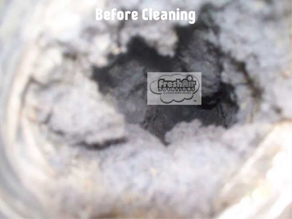 Dirty air duct interior, gray with clumps of debris, labeled 