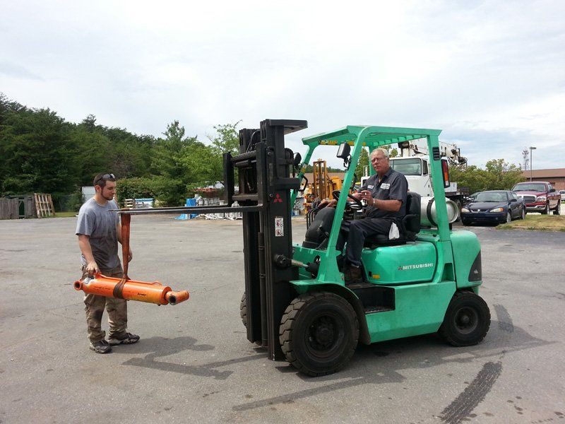 Man carrying hydraulic in power lift