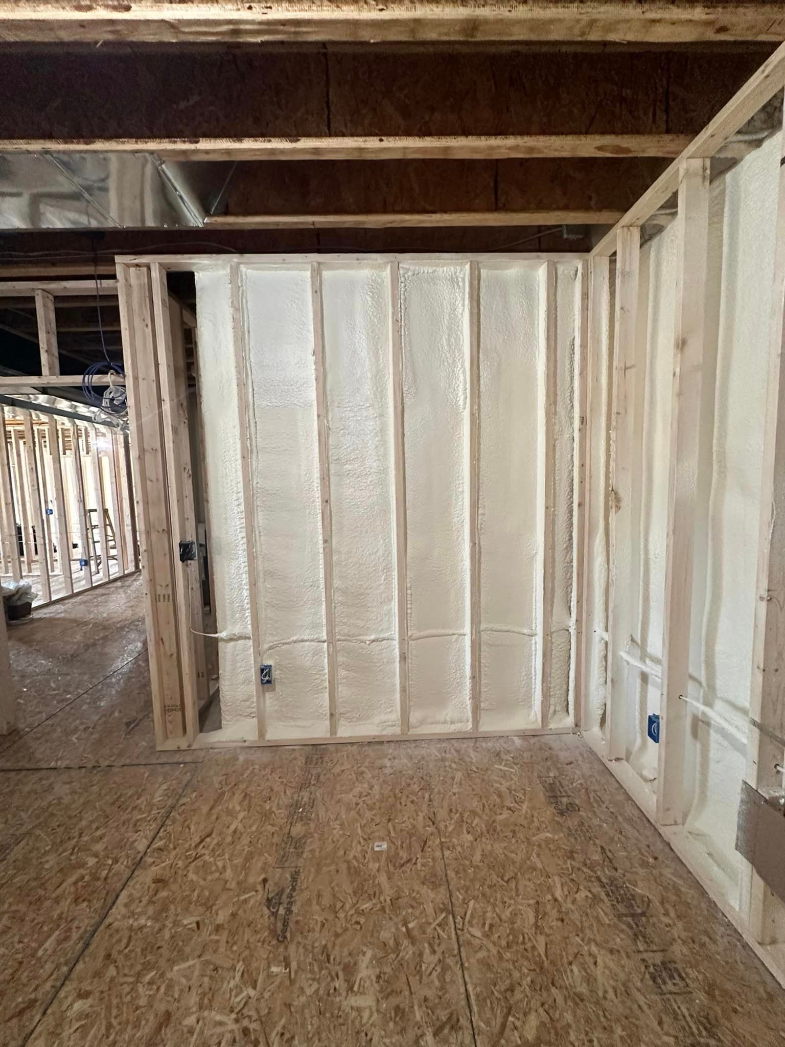 a room in a house under construction with foam on the walls